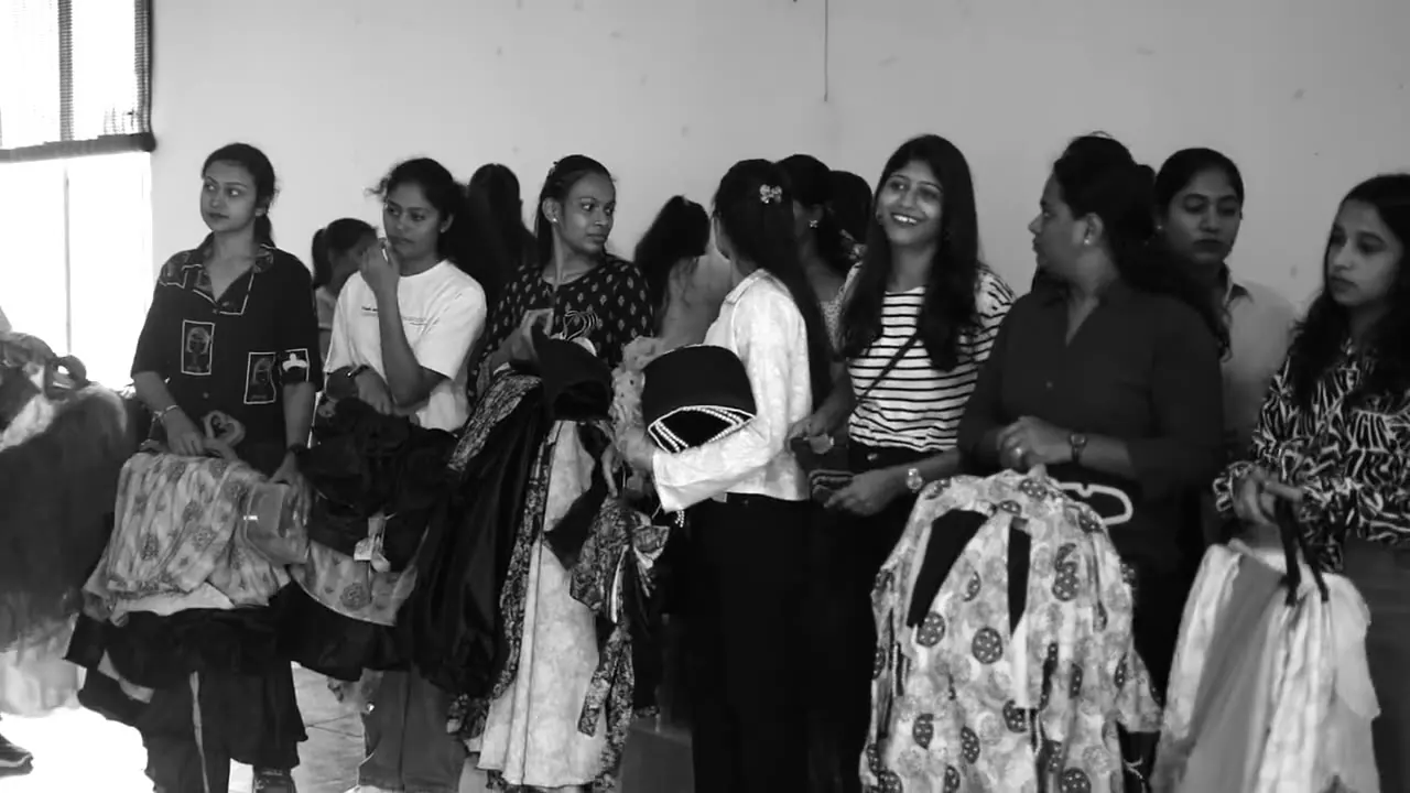 Students lined up with their garments backstage